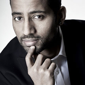 Logo/Portrait: Fotograf Ammaniel Hintza Logo/Portrait: Fotograf Ammaniel Hintza